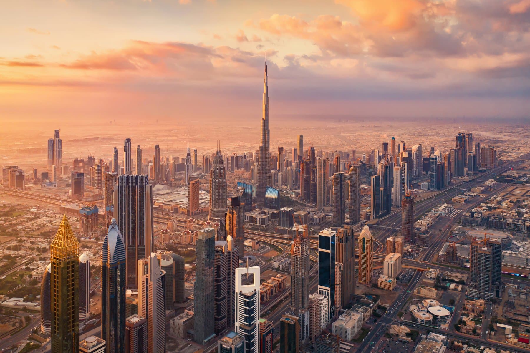 Aerial view of Downtown Dubai and the Burj Khalifa at sunset